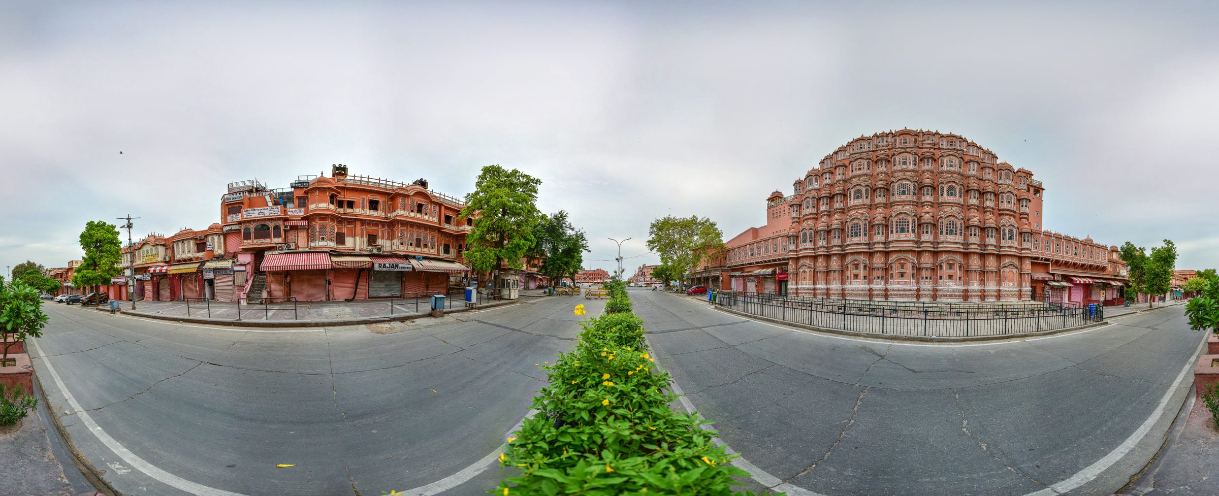 A panorama of an empty pink city road