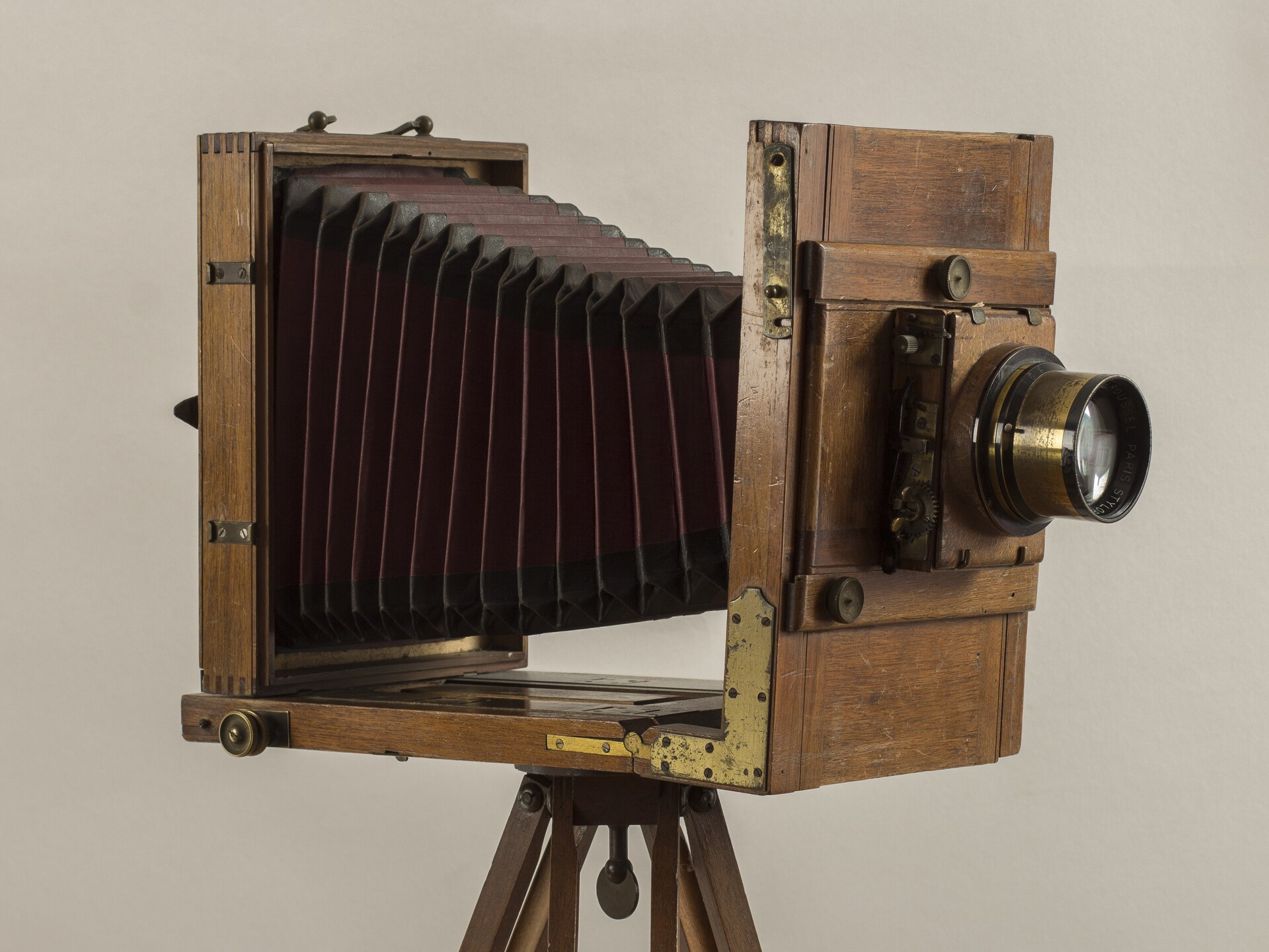 A wooden view camera on a tripod