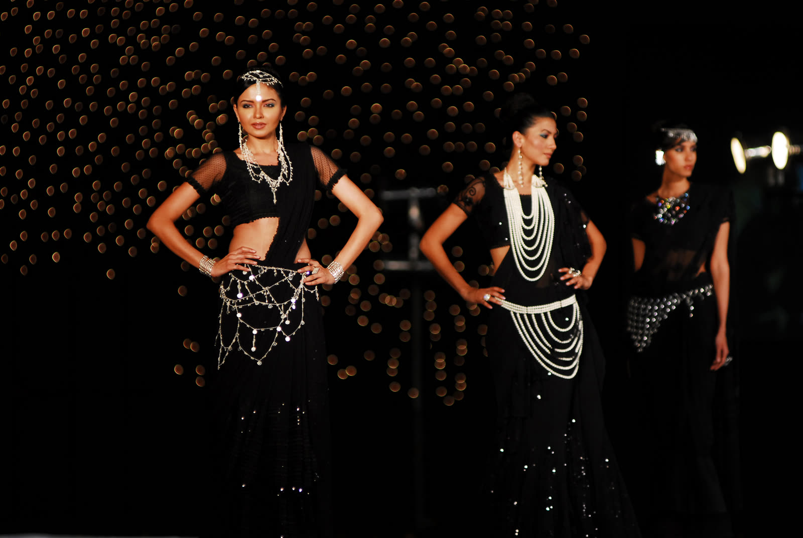 Models on a runway in black